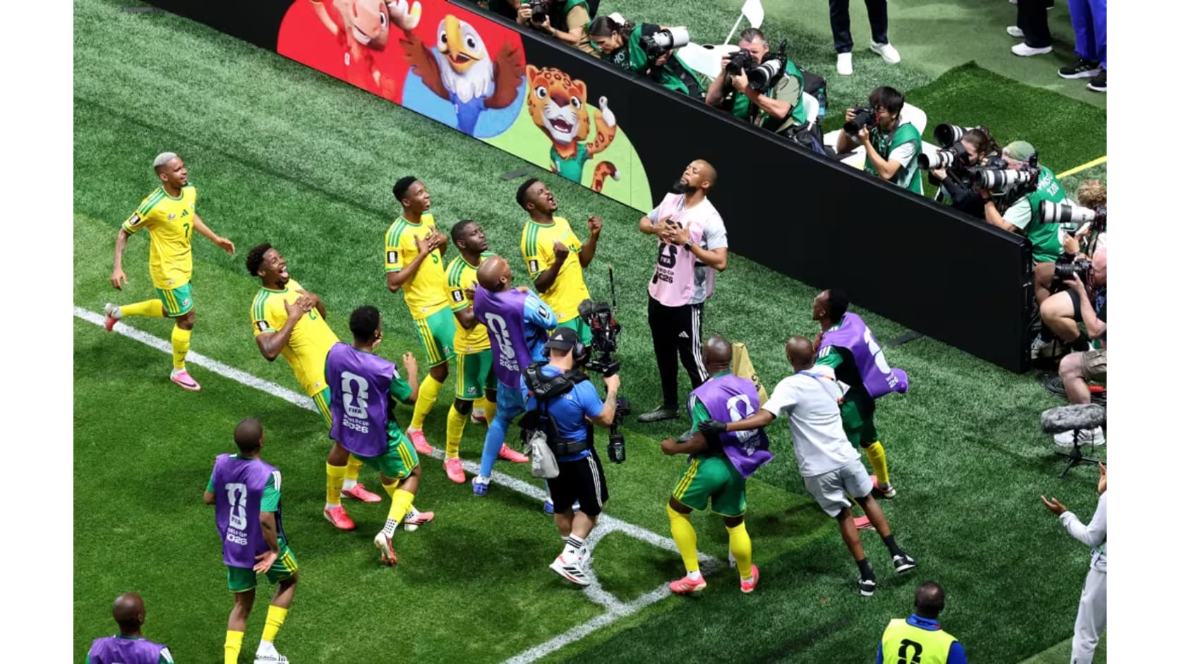 Mokoena celebrates after netting a late penalty, South Africa's first World Cup goal in 16 years, to earn his side a point.